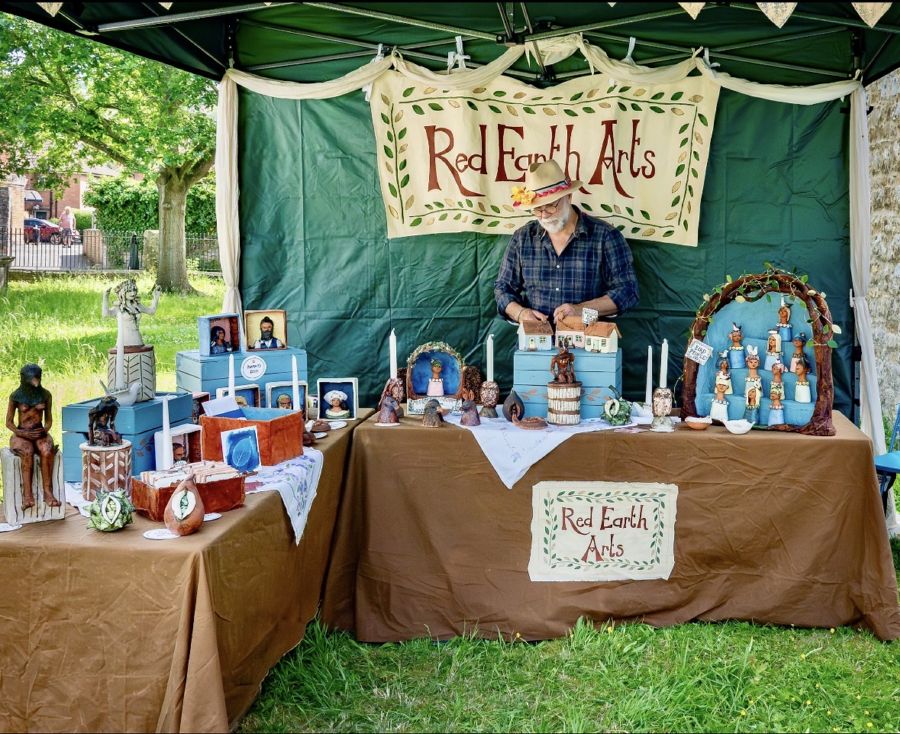 A trader's gazebo stall on the grass